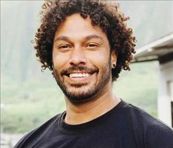 male-employee-wearing-black-shirt-smiling